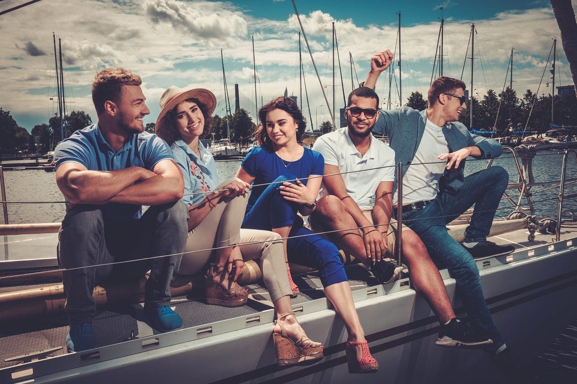 Happy friends resting on a yacht