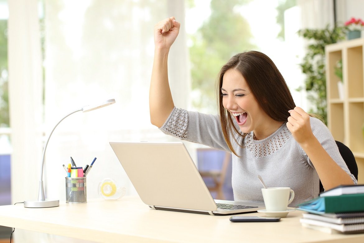 Euphoric woman being successful at home